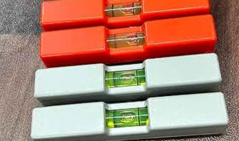 small ball or marble and a basic spirit level